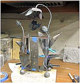 Welding Flowers to Frame
